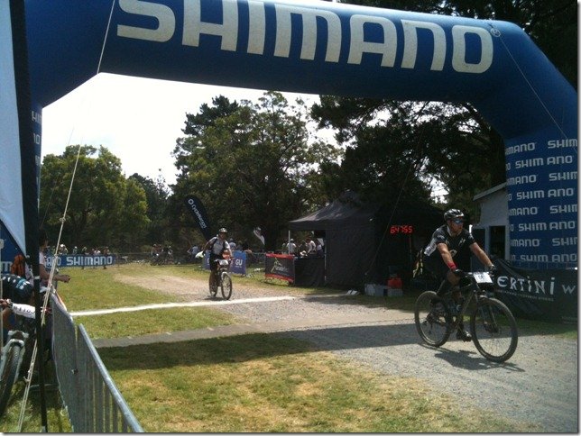 Crossing the finishing line after 6 hours and 35 minutes of riding